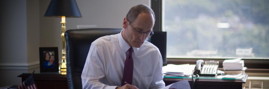 Photo of Jay A. Blechman, Esquire at his desk